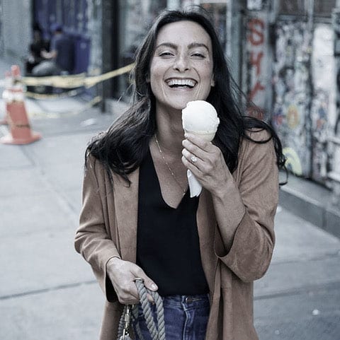 Food Confidence-Image of a happy woman eating ice cream cone, muted tones